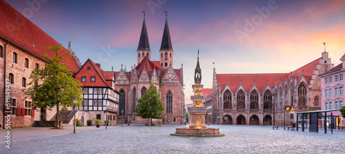 Brunswick, Germany. Panoramic cityscape image of historical downtown of Brunswick, Germany with St. Martini Church and Old Town Hall at summer sunset. photo