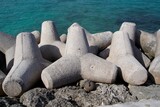 Lots of concrete tetrapods piled up along the seafront.