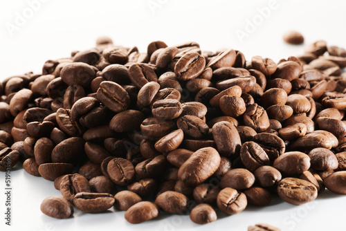 Roasted coffee beans isolated close up on white background  clipping path