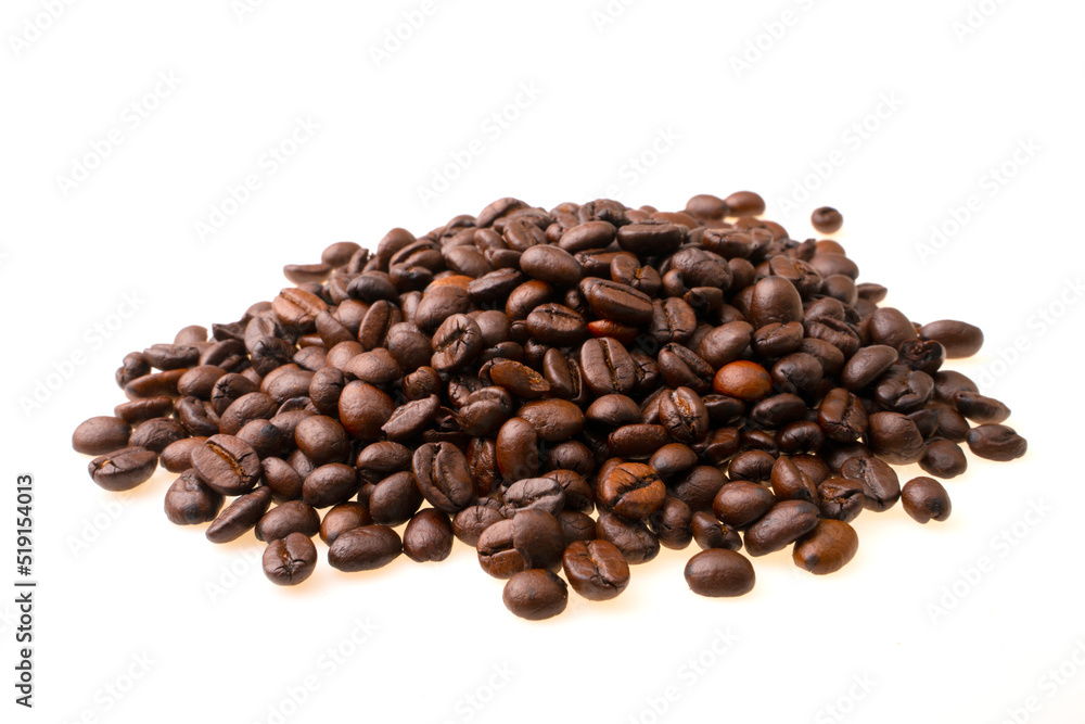 heap of coffee beans on a white background. soft focus.shallow focus effect. heap of coffee beans on a white background. soft focus.shallow focus effect.