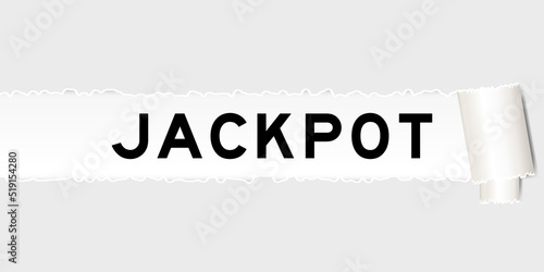 Ripped gray paper background that have word jackpot under torn part