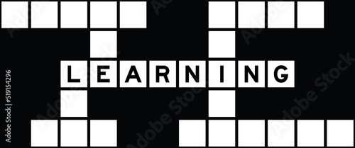 Alphabet letter in word learning on crossword puzzle background