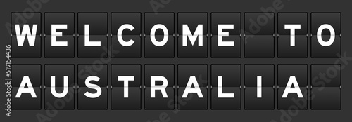 Black color analog flip board with word australia welcome to on gray background