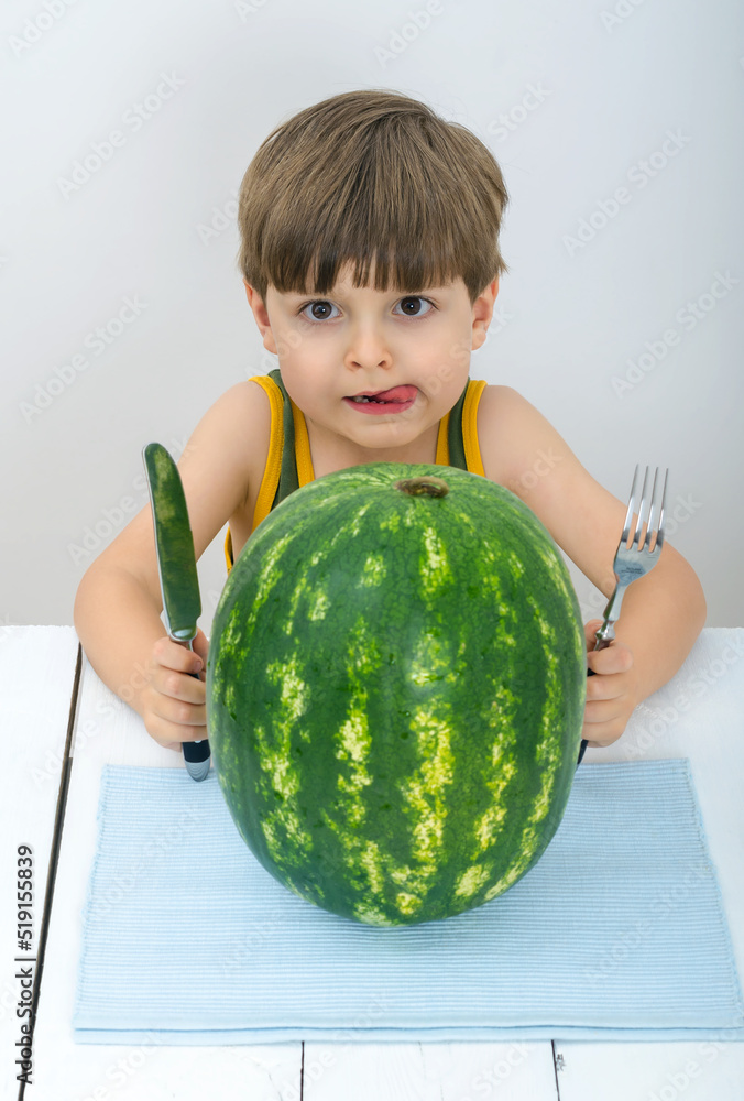 Cute child wants to eat a whole watermelon Cute child wants to eat a whole watermelon