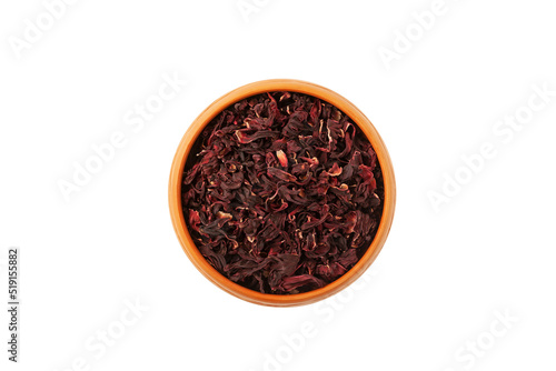 Dried hibiscus petals or Hibiscus sabdariffa in clay plate, top view. Karkade petals used to make delicious herbal tea. Sudanian rose