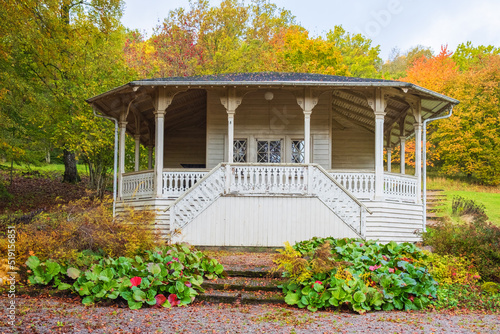 Idyllic pavilion in a park at autumn