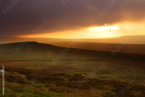 Dramatic Lighting over the Pennine Hills at Sunset, North Yorkshire, UK England.
