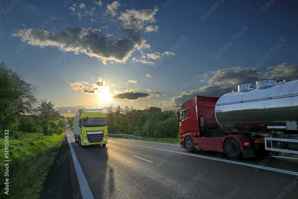 Landscape with a moving truck on the highway at sunset. Landscape with a moving truck on the highway at sunset.