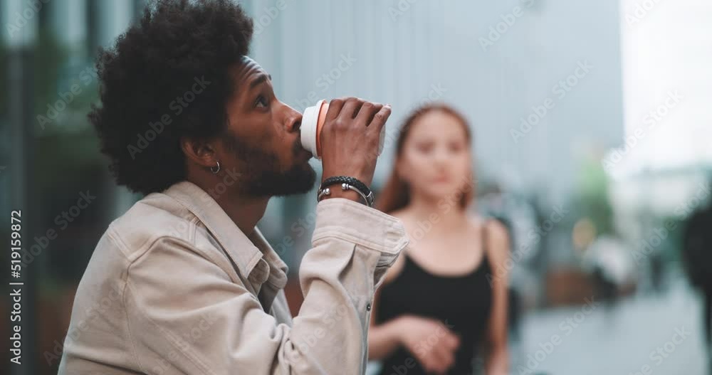 Boy drinking coffe and a girl trying vr goggles Boy drinking coffe and a girl trying vr goggles