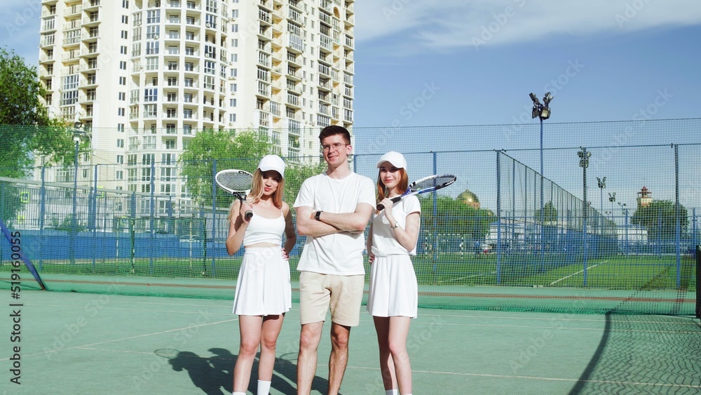 4K. Guy and girls tennis players posing on camera