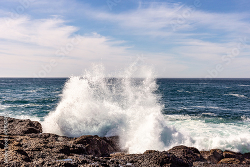 A view on Pacific ocean, cast, rocks and waves
