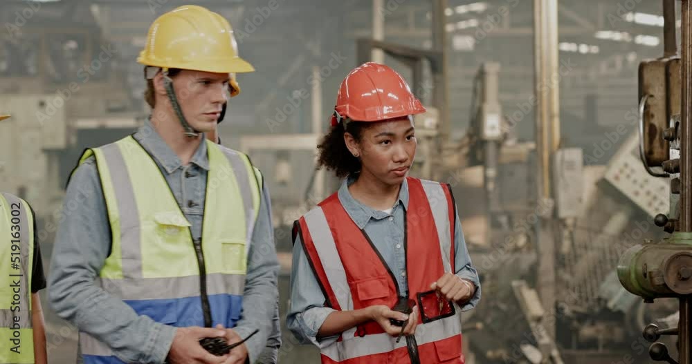 Blue-collar Worker. multi-ethnic team of technician and engineer are checking machinery in operation in industrial plant team work of repair inspector complete maintenance of machine equipment. Blue-collar Worker. multi-ethnic team of technician and engineer are checking machinery in operation in industrial plant team work of repair inspector complete maintenance of machine equipment.