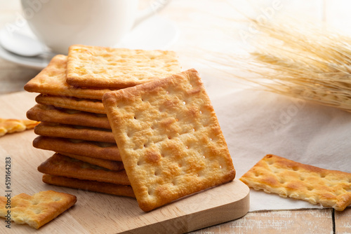 Fényképezés Heap of Dry thin crispy crackers on cutting board on wood table