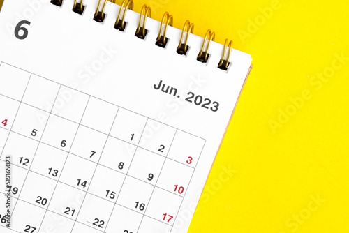 june calendar 2023 on a yellow background.