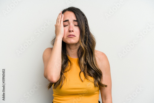 Young caucasian woman isolated on white background tired and very sleepy keeping hand on head.