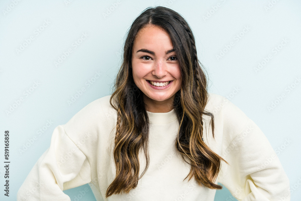 Young caucasian woman isolated on blue background happy, smiling and cheerful. Young caucasian woman isolated on blue background happy, smiling and cheerful.