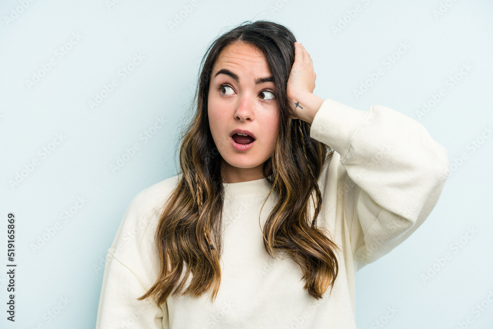 Young caucasian woman isolated on blue background being shocked, she has remembered important meeting. Young caucasian woman isolated on blue background being shocked, she has remembered important meeting.