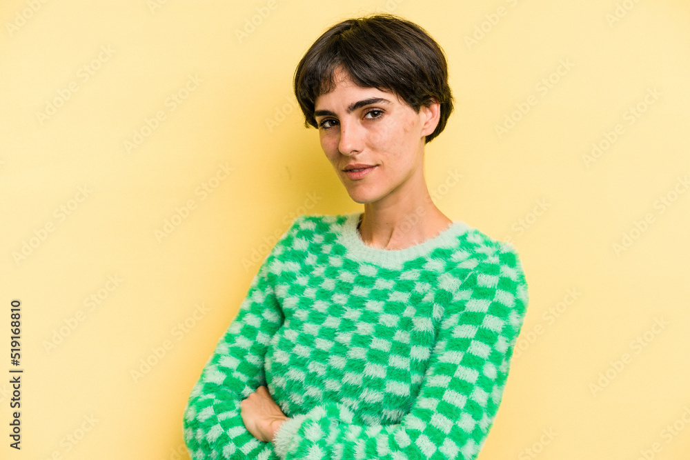 Young caucasian woman with a short hair cut isolated who feels confident, crossing arms with determination. Young caucasian woman with a short hair cut isolated who feels confident, crossing arms with determination.