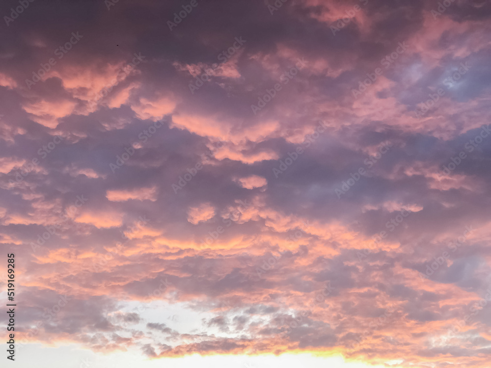 pink clouds in the sky at sunset