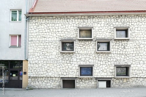 The facade of the building is made of a local variety of limestone known as the pinchak or Pinchow stone. Pinczow, Ponidze, Poland