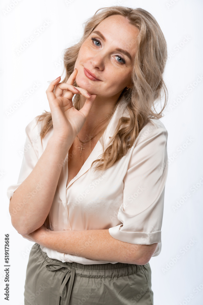 portrait of a woman. Girl with flowing hair in a creamy beige satin blouse. mature beauty concept. isolated, white background portrait of a woman. Girl with flowing hair in a creamy beige satin blouse. mature beauty concept. isolated, white background