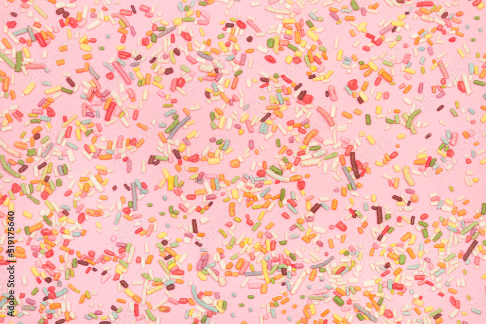 Patrón de chispas de colores para un fondo de la pancarta de diseño, afiche, volante, tarjeta, postal, portada, folleto sobre un fondo rosa pastel. Vista superior y de cerca. Patrón de chispas de colores para un fondo de la pancarta de diseño, afiche, volante, tarjeta, postal, portada, folleto sobre un fondo rosa pastel. Vista superior y de cerca.