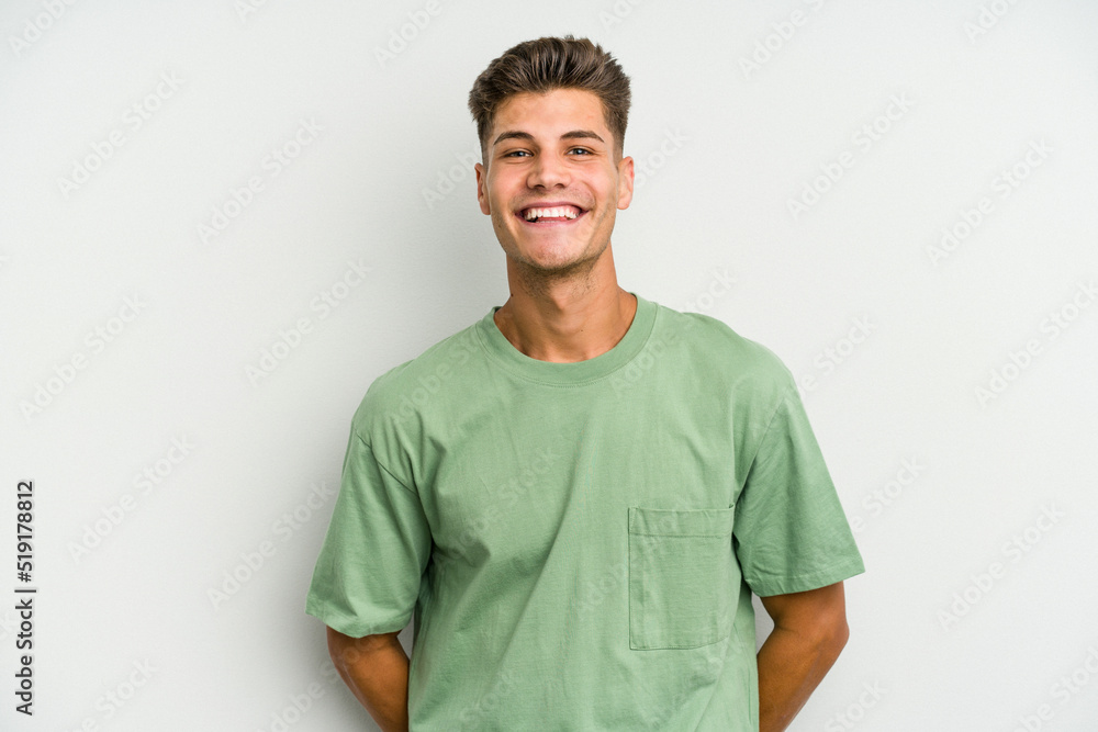 Fototapeta premium Young caucasian man isolated on white background happy, smiling and cheerful.