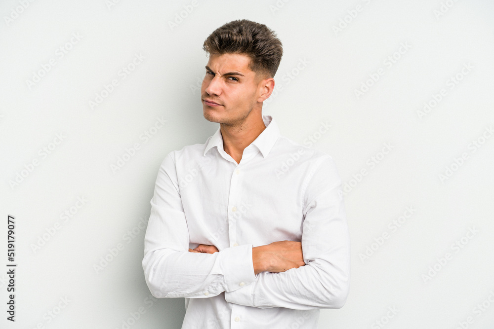 Young caucasian man isolated on white background unhappy looking in camera with sarcastic expression. Young caucasian man isolated on white background unhappy looking in camera with sarcastic expression.