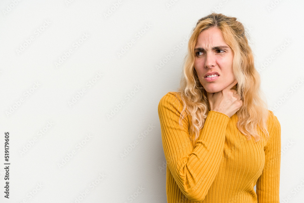 Young caucasian woman isolated on white background touching back of head, thinking and making a choice. Young caucasian woman isolated on white background touching back of head, thinking and making a choice.