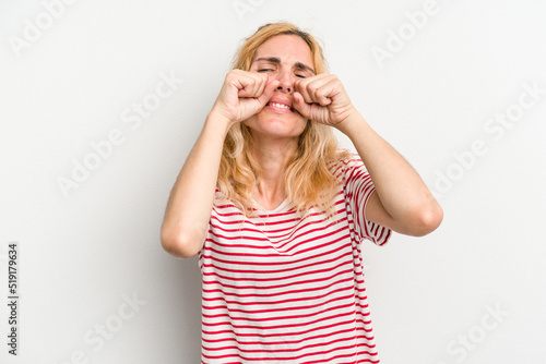 Young caucasian woman isolated on white background whining and crying disconsolately.