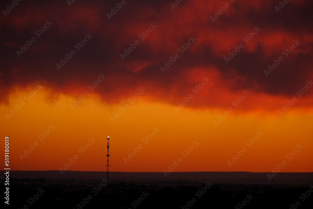 Cell Tower for Digital Communication at Sunset Silhouette Cell Tower for Digital Communication at Sunset Silhouette