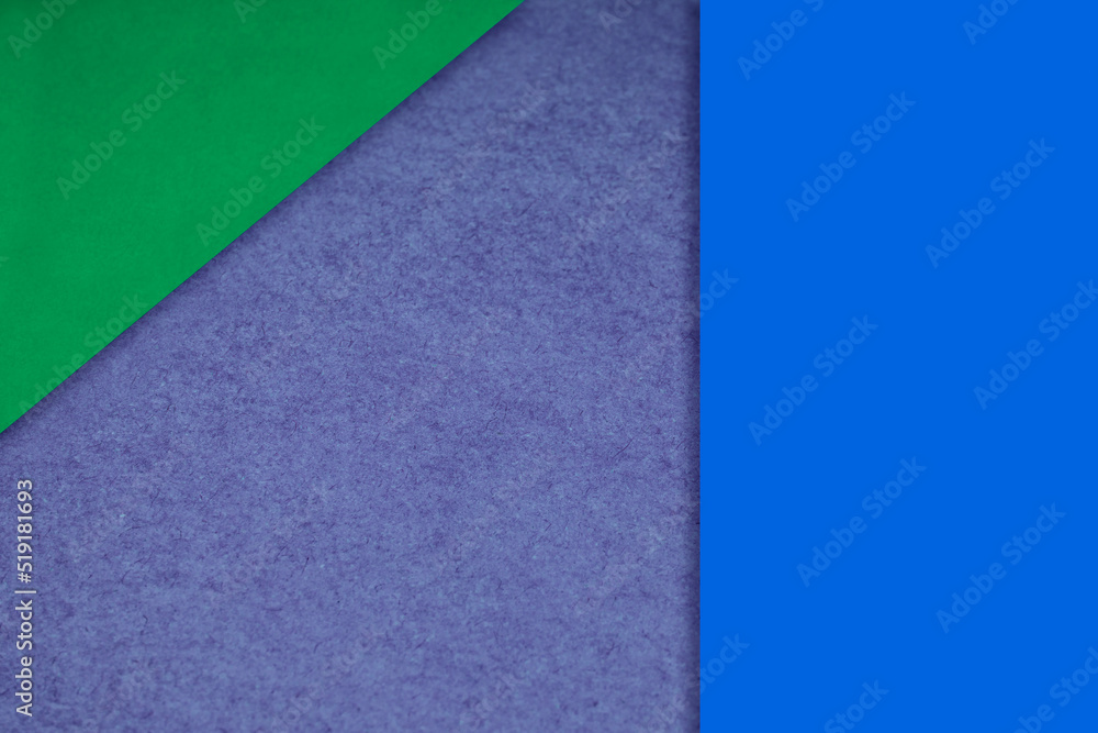Textured and plain green purple blue sheet papers forming two triangles and vertical blank rectangle for creative cover designing