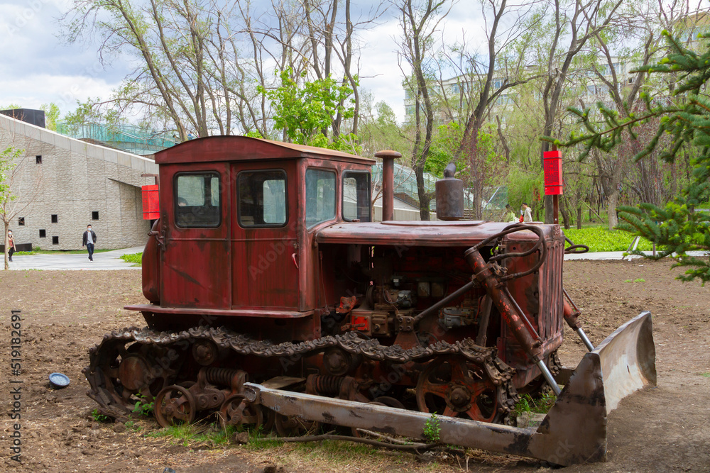 Fototapeta premium Changchun, Jilin, USA - April 29 2021:Bull dozer farm Vehicles close up.
