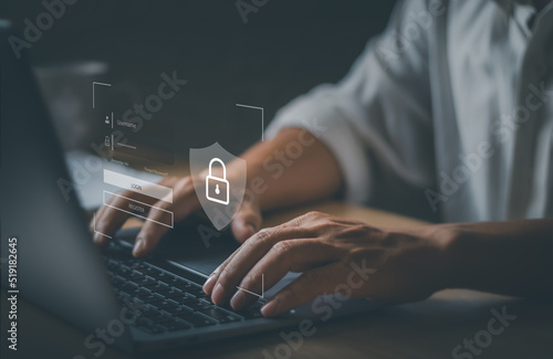 Fototapeta Naklejka Na Ścianę i Meble -  Man's hand on keyboard showing technology privacy protection, virtual padlock icon available in online network, password access, online internet security concept