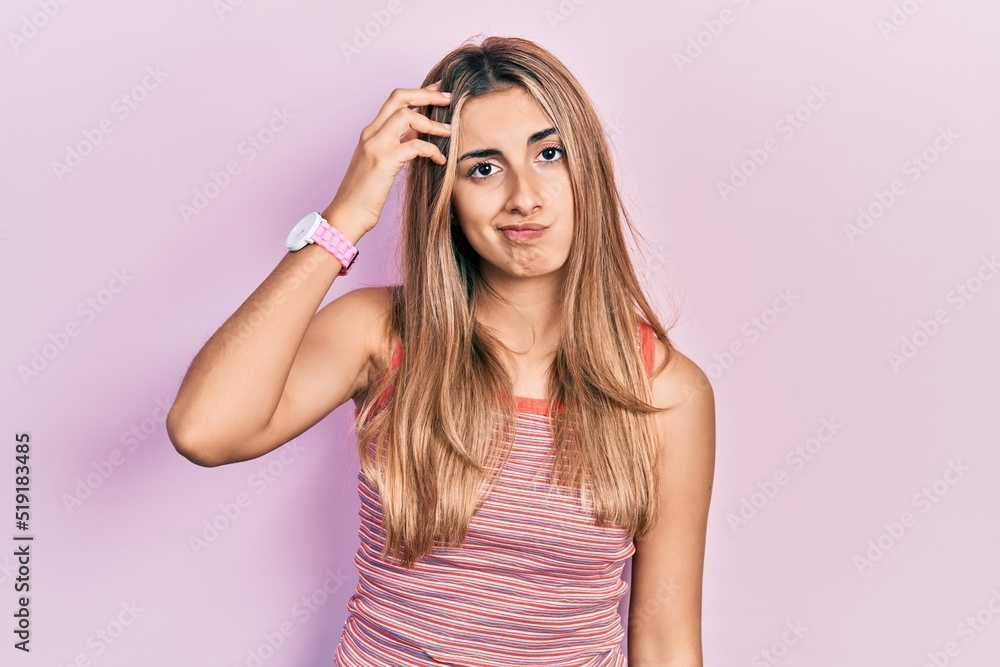 Beautiful hispanic woman wearing casual summer t shirt worried and stressed about a problem with hand on forehead, nervous and anxious for crisis Beautiful hispanic woman wearing casual summer t shirt worried and stressed about a problem with hand on forehead, nervous and anxious for crisis
