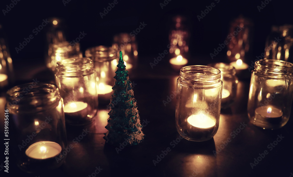 Background with candles in glass vessels. Candles burn in a dark place. Rest in peace. Background with candles in glass vessels. Candles burn in a dark place. Rest in peace.