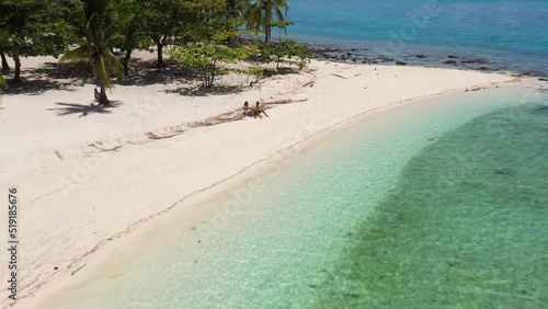 Sandy Beach And Scenic Blue Waters Of Kalanggaman Island In Palompon, Leyte Province, Philippines. Aerial Pullback Shot photo