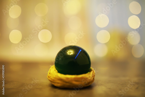 Background with glowing ball and bokeh. Ball for predictions. Clairvoyant ball.