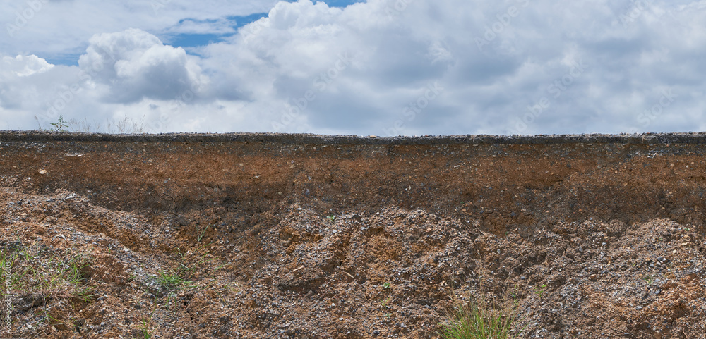 Soil layer caused by road collapse. Stock Photo | Adobe Stock