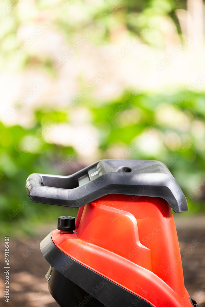 electric shredder mulcher against the background of the garden electric shredder mulcher against the background of the garden
