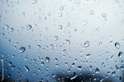 Drops of rain on the glass background
