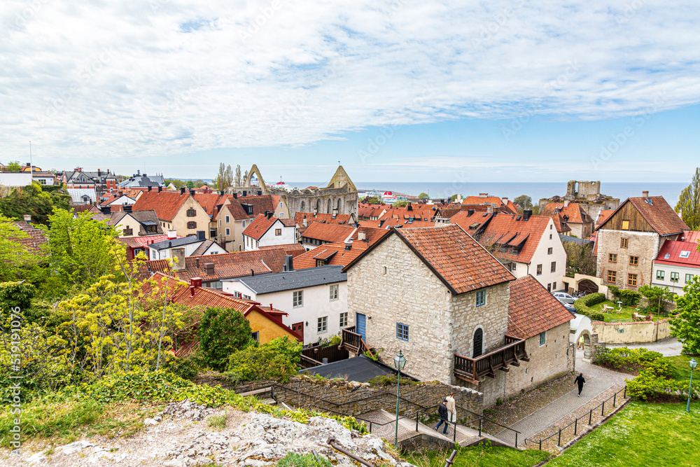 The ruins of St Katarina church in the Great Square (Stora Torget) seen over the rooves of the medieval town of Visby on the island of Gotland in the Baltic Sea off Sweden