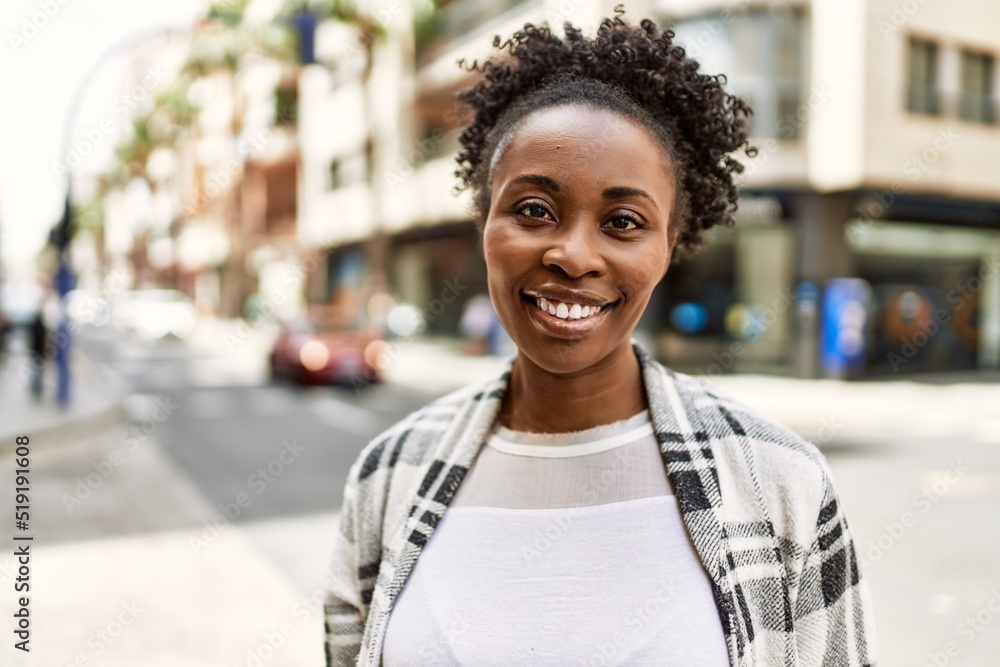 Young african american girl smiling happy standing at the city. Young african american girl smiling happy standing at the city.