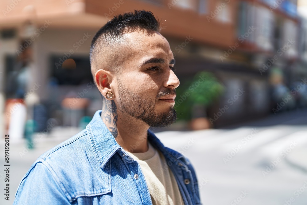 Young hispanic man smiling confident talking on the smartphone at street Young hispanic man smiling confident talking on the smartphone at street