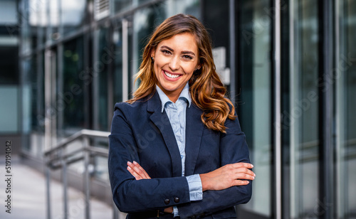 Smiling businesswoman in front of the corporation. Business  lifestyle concept