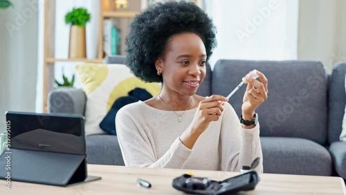 Woman with syringe preparing an insulin injection at home with an online tutorial. One girl injecting self with medicine treatment to treat chronic illnesses type 1 2 diabetes, high blood or glycemia photo