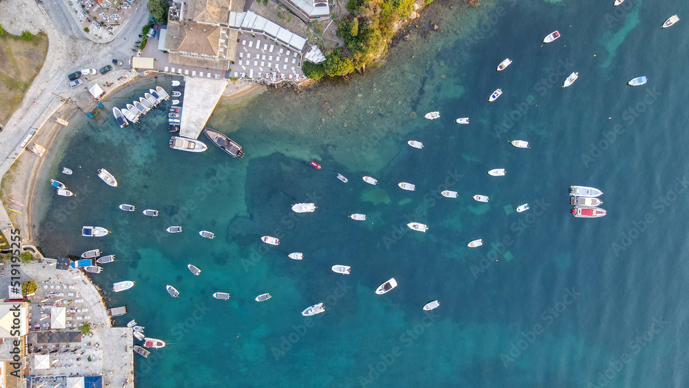 Aerial drone top down photo of sail boats and yachts anchored in traditional fishing village of Sivota, Ionian, Greece. Point Piper suburbs aerial view from Helicopter