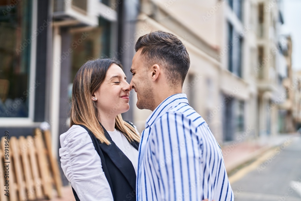 Man and woman couple smiling confident standing together at street Man and woman couple smiling confident standing together at street