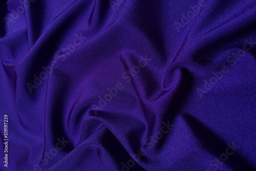 Purple supplex crumpled or wavy fabric texture background. Abstract linen cloth soft waves. Silk fabric. Smooth elegant luxury cloth texture. Concept for banner or advertisement.
