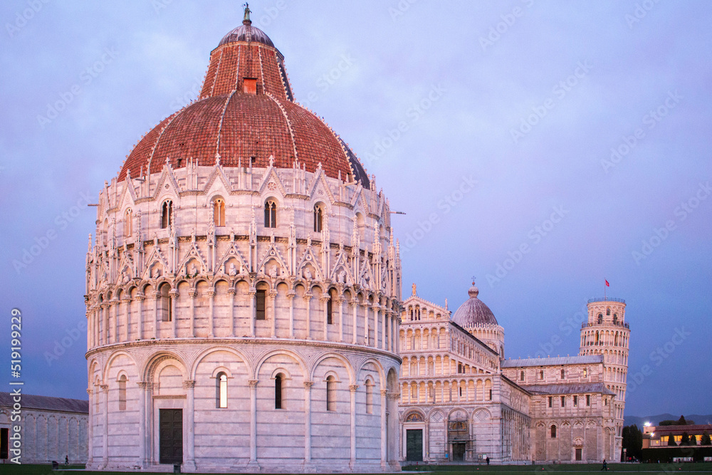 Baptistery of Pisa, in the foreground, during an incredible pink sunset. Italy. 